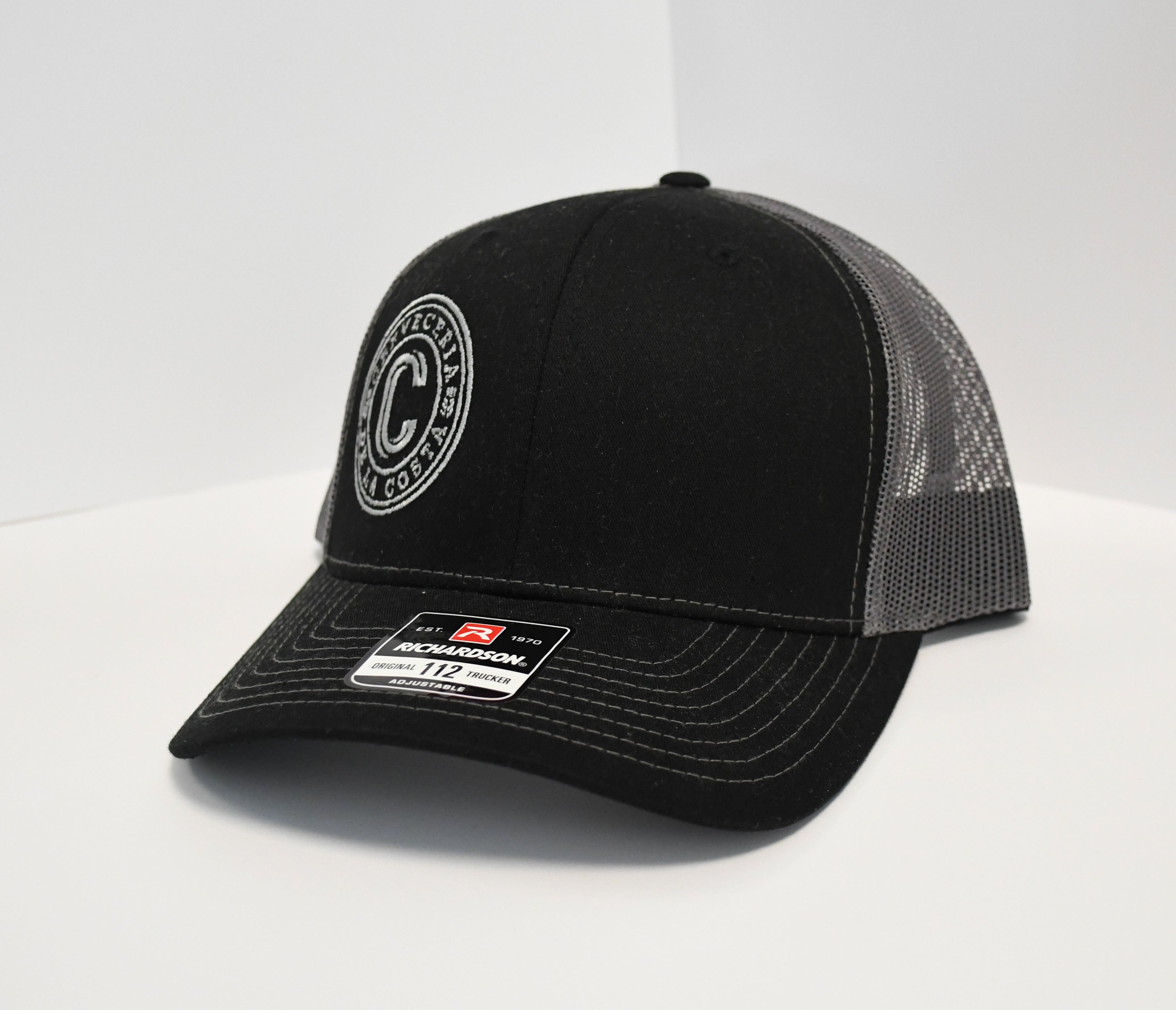 Gorra negra bordado De la Costa