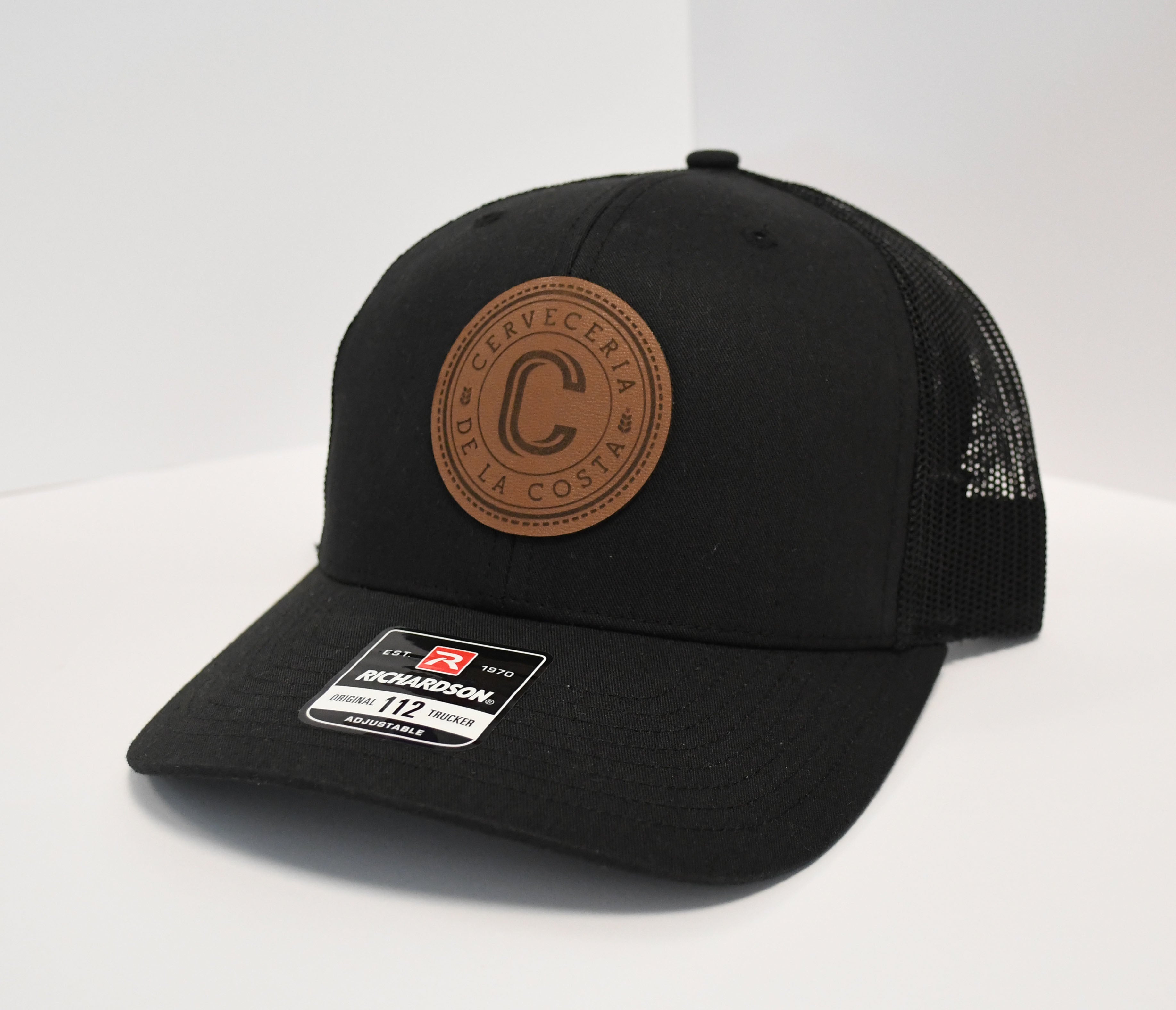 Gorra logo De la Costa piel